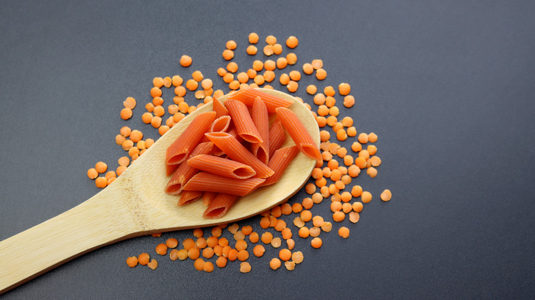 Spoon of red lentil penne