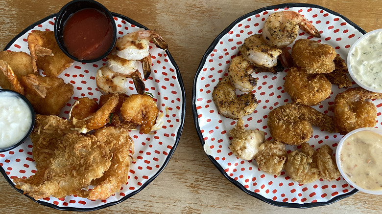 Shrimp and sauce overloading plates