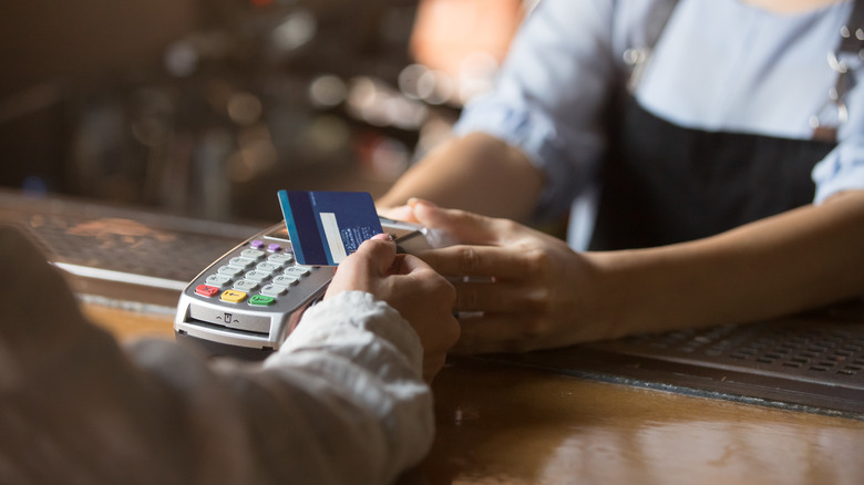 customer paying at register