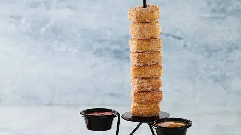 donuts stacked tall dipping sauces