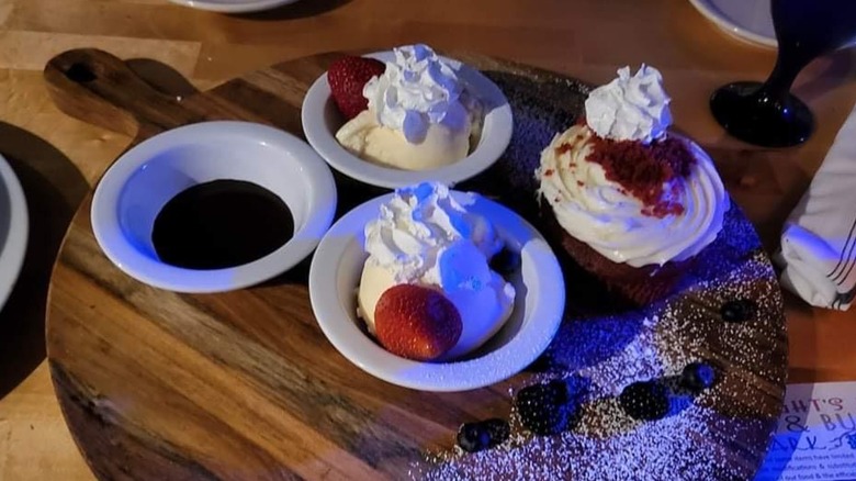  Mini red velvet cake desserts on wooden board