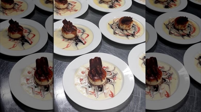 Plates of cheesecake in creme anglaise