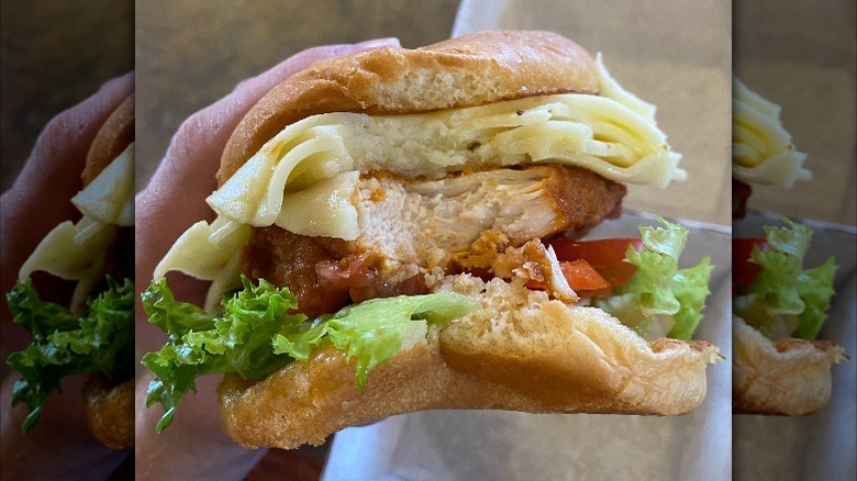 A Chick-fil-A sandwich with extra, extra cheese.