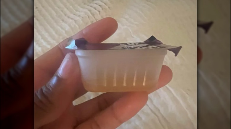 Empty Wendy's sauce container