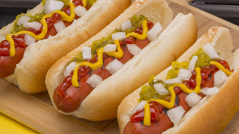 hot dogs with ketchup, mustard, relish, and onion