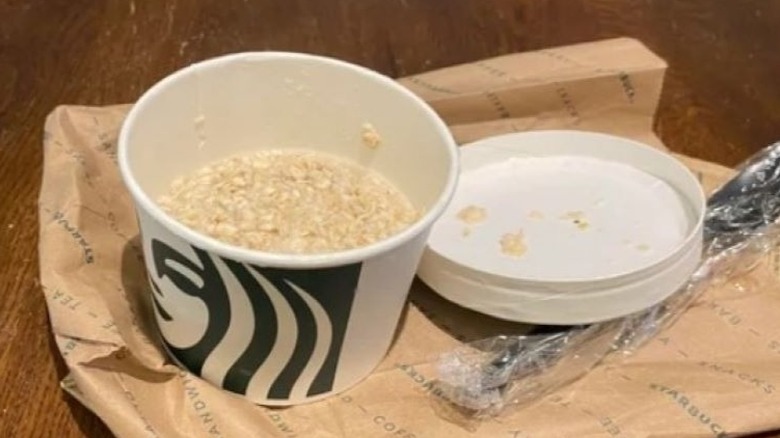 Bowl of Starbucks oatmeal on a bag with lid off