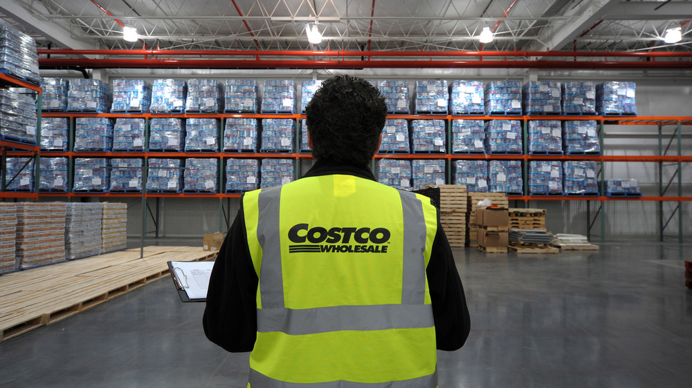 Costco employee checks inventory