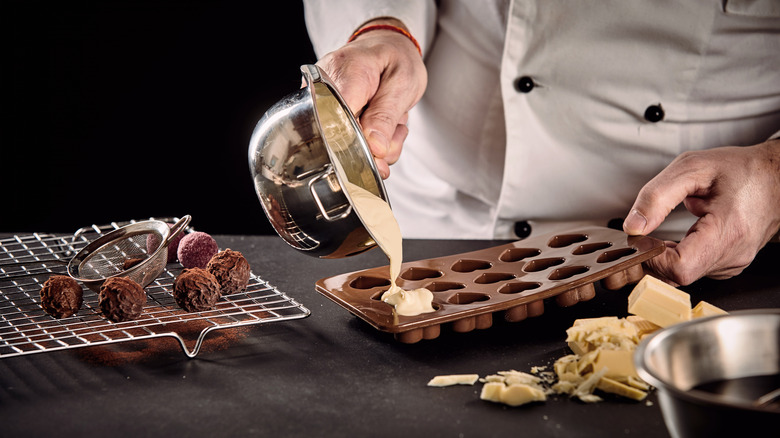 chocolatier makes chocolate truffles