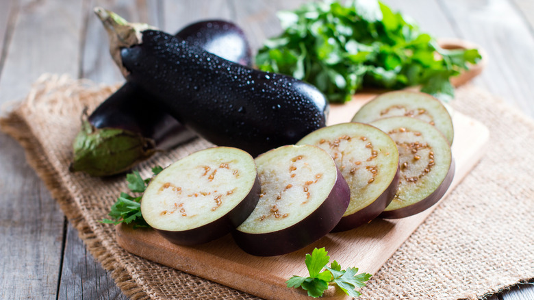 Sliced eggplant on cutting board