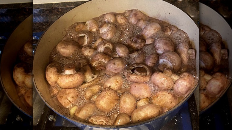 Burgundy mushrooms cooking on stove