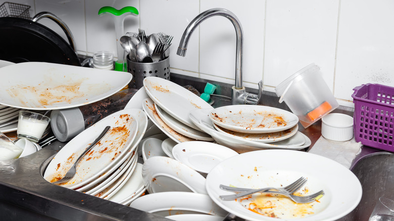 A sink filled with dirty dishes