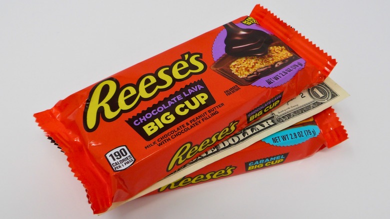 Dollar bill between packages of Reese's