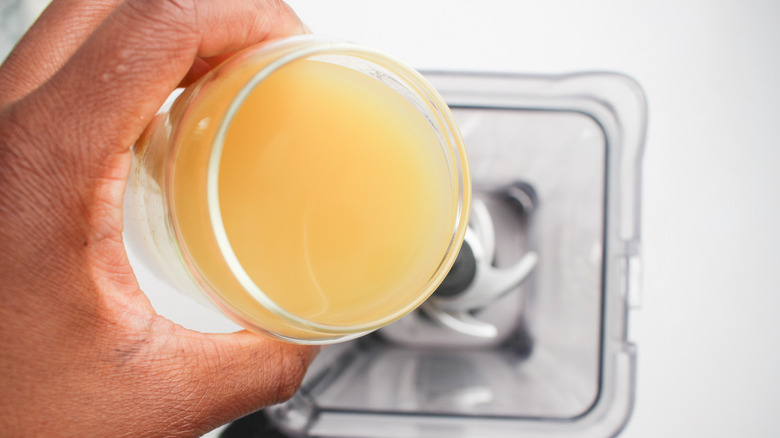 pineapple juice poured into blender