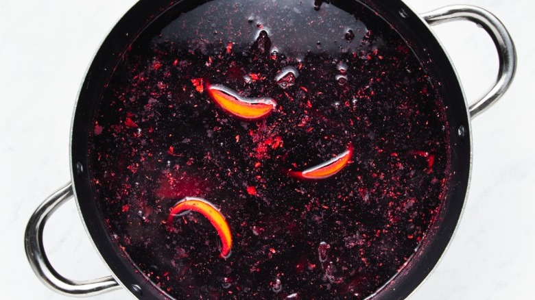 pot with hibiscus and orange peel