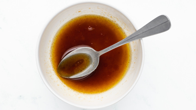 mixing salad dressing in bowl