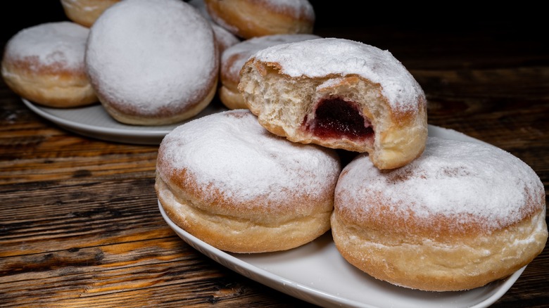 Plate of paczki (jam-filled, powdered donuts)