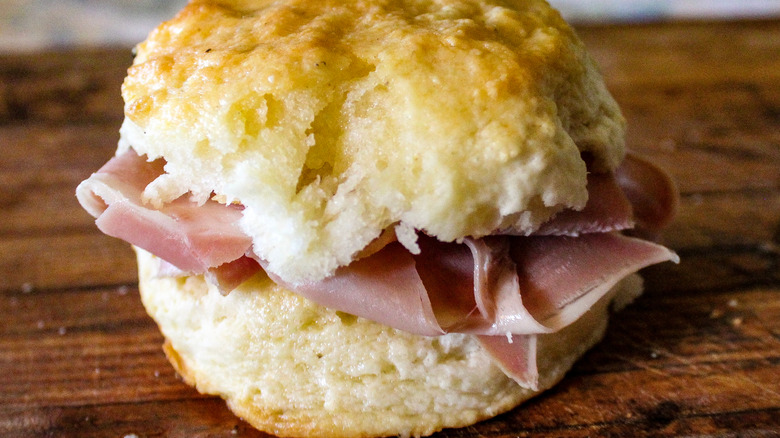 Country ham biscuit on wood board