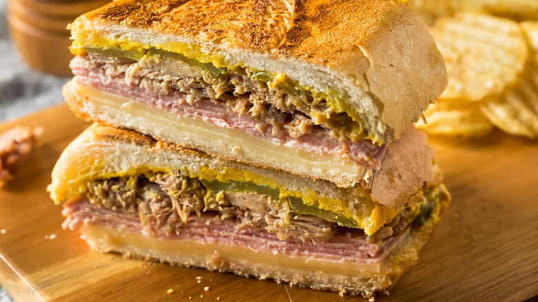 Cuban Sandwich halves on wooden board