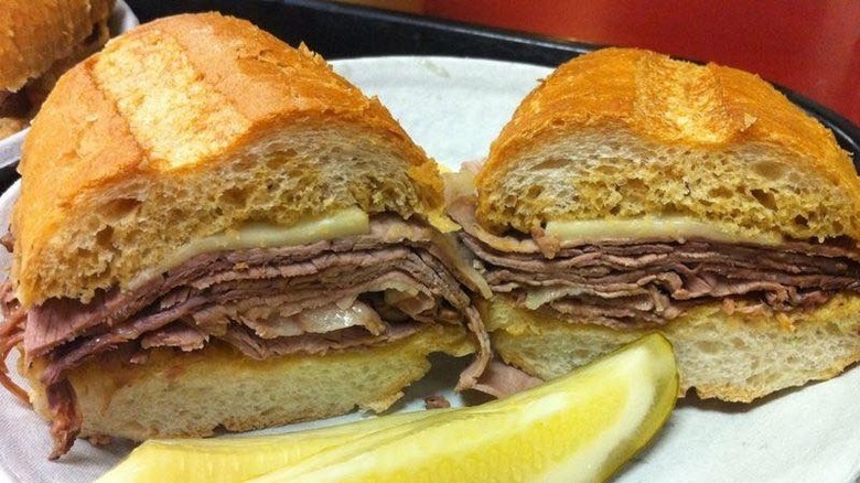 French Dip sandwich with pickle spear on plate