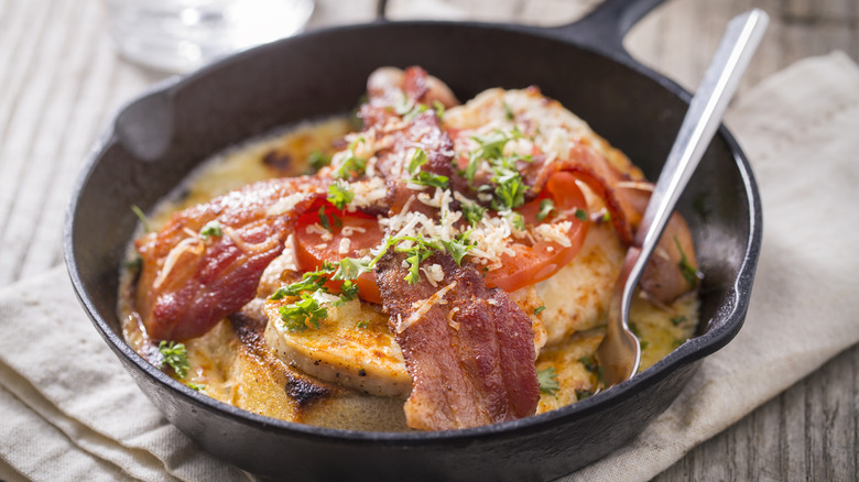 Hot Brown sandwich in skillet with spoon