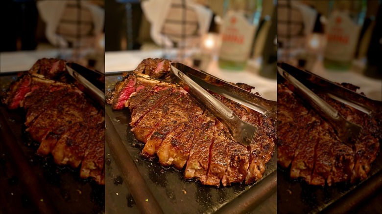 al biernat's steak with tongs