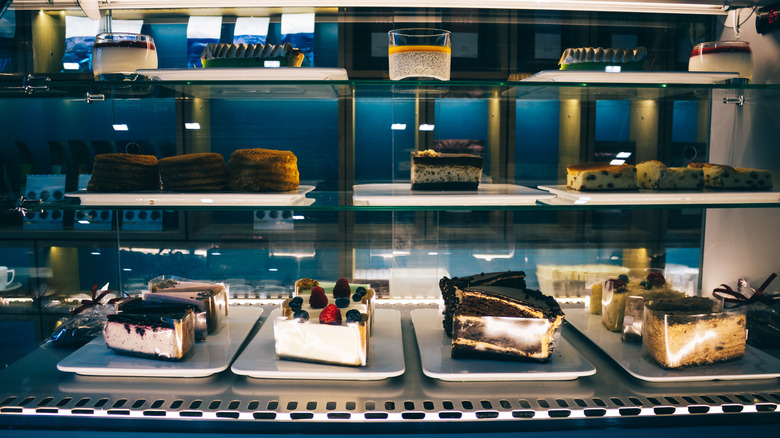 Glass counter with cakes 