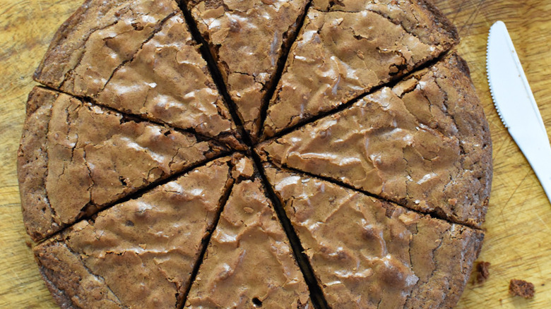 round brownie sliced in wedges