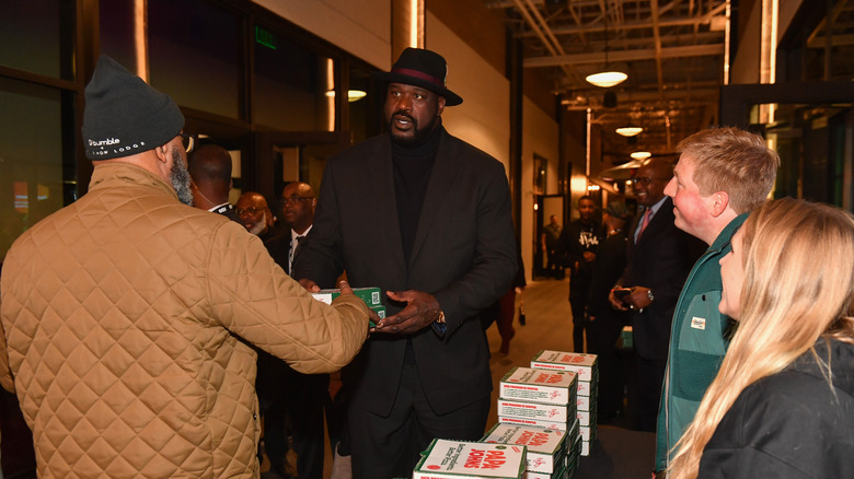 Shaq and a stack of pizza boxes 