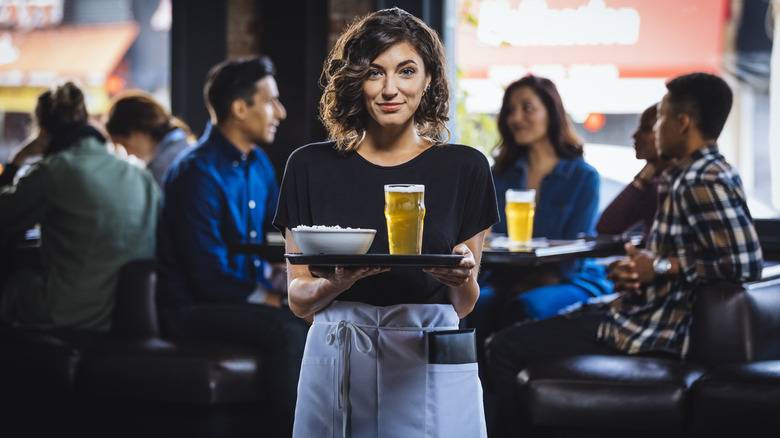 restaurant server waiting with beer