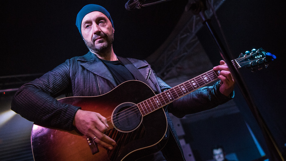 Joe Bastianich poses with a motorcycle