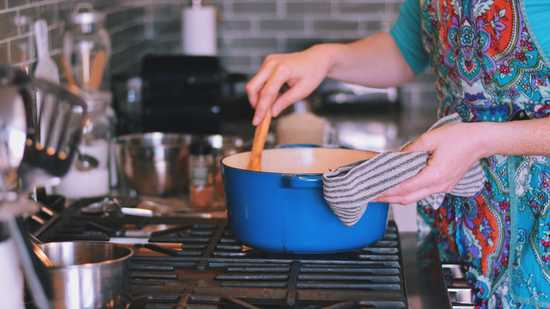 stirring Dutch oven pot on stove