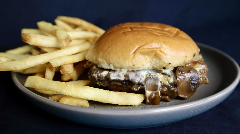 burger on plate with fries