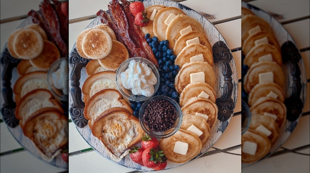 Breakfast charcuterie board with pancakes and toast