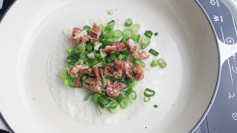 scallions, ham, and rice paper in pan