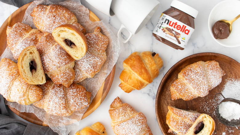 wooden bowls loaded with Nutella filled croissants