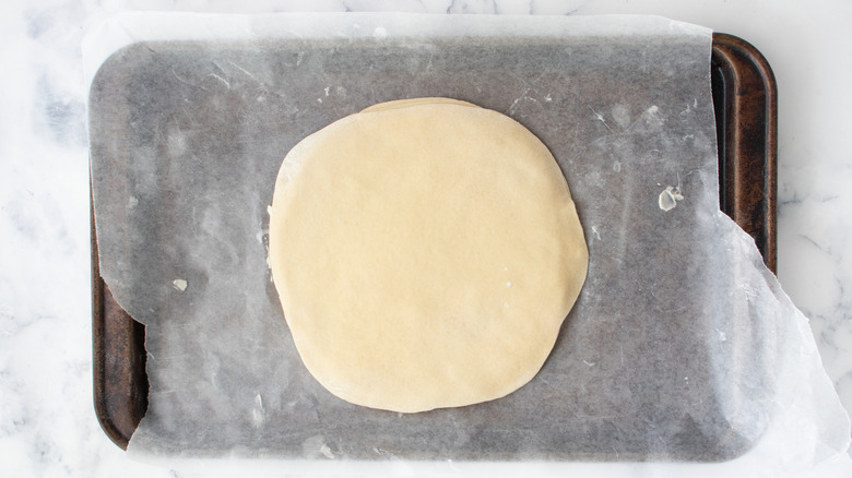 Stacked dough disks on baking sheet