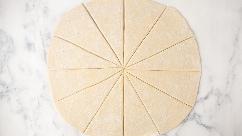 Flat dough circle sliced in 12 wedges