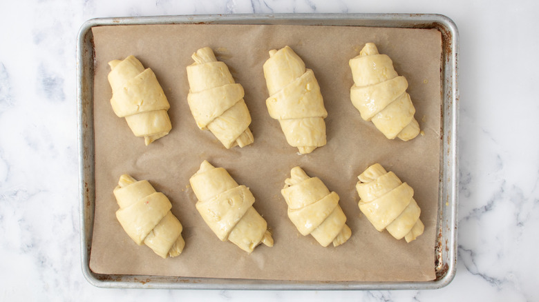 Croissant dough brushed with egg wash