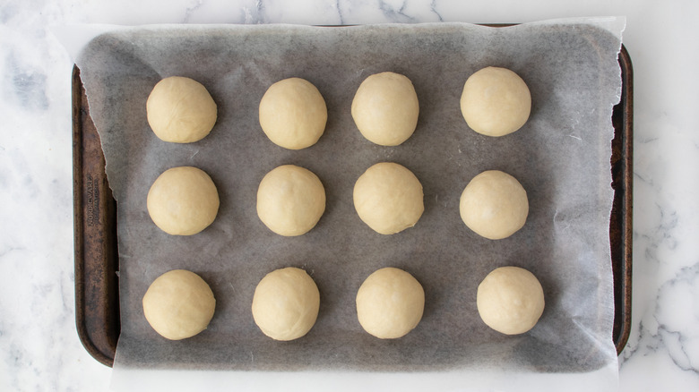 12 dough balls on baking sheet