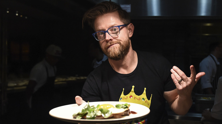 Richard Blais holding plate with salad