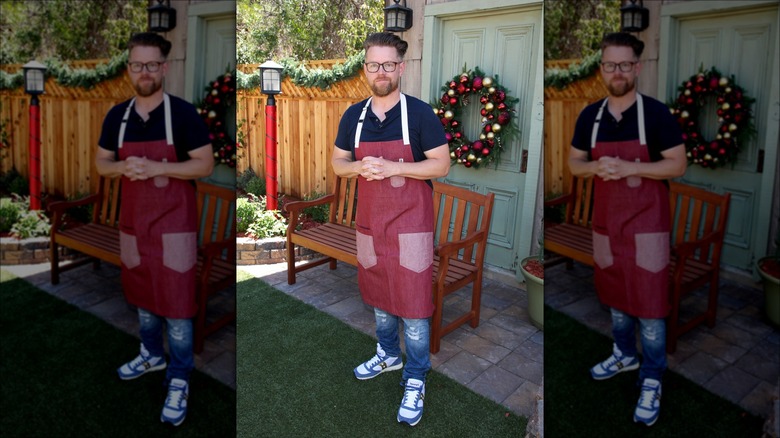 Richard Blais in front of Christmas wreath