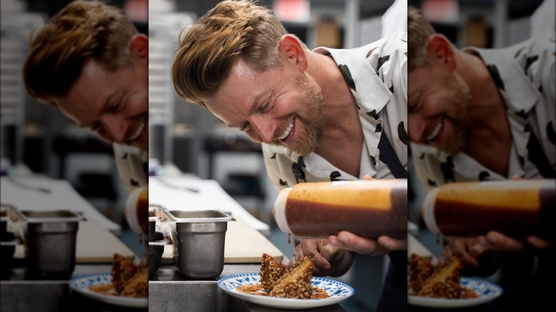 Richard Blais pours sauce on food