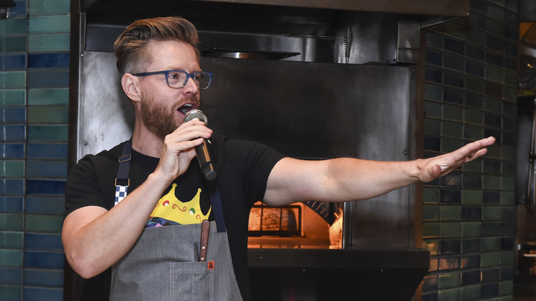 Richard Blais speaking into a mic