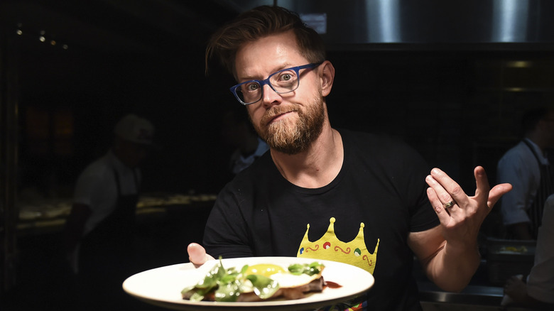 Richard Blais holding plate of food