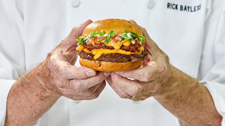 Chef Bayless holding the Chorizo Cheeseburger