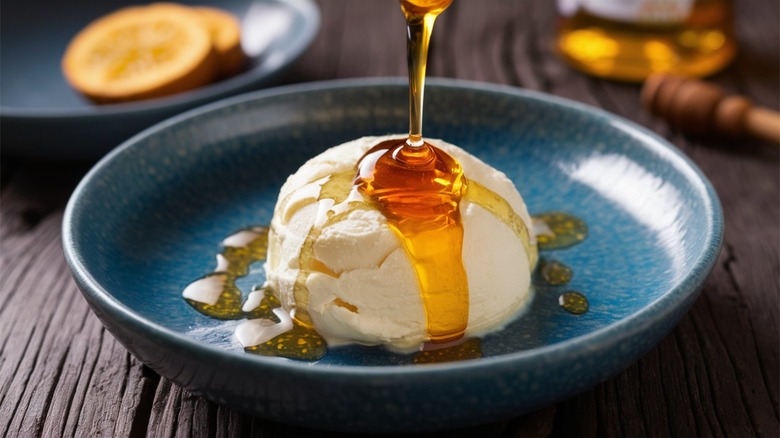 honey pouring onto ricotta