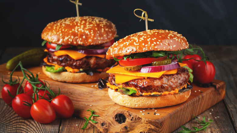 Burgers on brown wood