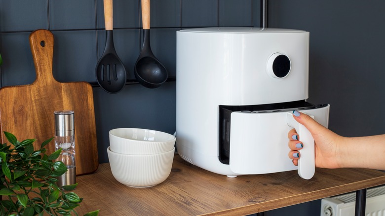 opening air fryer on counter