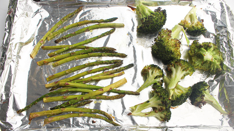 broccoli and asparagus on baking sheet