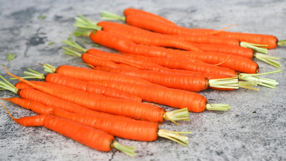 peeled carrots on countertop